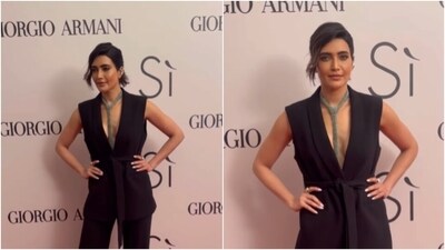 Karishma Tanna's black pantsuit has our hearts. The actor looked stunning in a black sleeveless blazer and matching formal trousers. She accessorised her look with a shimmery silver tie. (Instagram/@viralbhayani) Karishma Tanna's black pantsuit has our hearts. The actor looked stunning in a black sleeveless blazer and matching formal trousers. She accessorised her look with a shimmery silver tie. (Instagram/@viralbhayani)