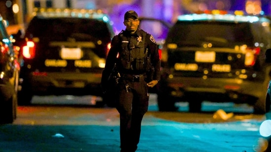 Oakland police officers respond to a multiple shooting during a Juneteenth celebration near Lake Merritt in Oakland, Calif., on Wednesday, June 19, 2024. A Juneteenth celebration in Oakland, California, turned violent when several people were shot, police said. (Ray Chavez /Bay Area News Group via AP) (AP)