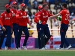 England's Mark Wood (R) celebrates with England's captain Jos Buttler and teammates after running out South Africa's Heinrich Klaasen during the ICC men's Twenty20 World Cup 2024 Super Eight cricket match between England and South Africa at Daren Sammy National Cricket Stadium in Gros Islet, Saint Lucia. England's Mark Wood (R) celebrates with England's captain Jos Buttler and teammates after running out South Africa's Heinrich Klaasen during the ICC men's Twenty20 World Cup 2024 Super Eight cricket match between England and South Africa at Daren Sammy National Cricket Stadium in Gros Islet, Saint Lucia.