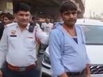 The officer was dragged a few metres after leaning through the driver's door to examine the papers, with the driver suddenly speeding the vehicle 
(PTI Twitter)