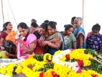 Relatives mourn near the mortal remains of people who died after consuming spurious liquor, in Kallakurichi. (PTI) Relatives mourn near the mortal remains of people who died after consuming spurious liquor, in Kallakurichi. (PTI)