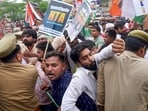 Varanasi: Police personnel try to stop Congress workers during their protest march over the alleged irregularities in NEET-UG 2024 results, in Varanasi, Saturday, June 22, 2024. (PTI Photo)(PTI06_22_2024_000363B)