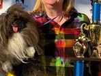 Wild Thang, the winner of 2024 'World’s Ugliest Dog' contest, with its owner.