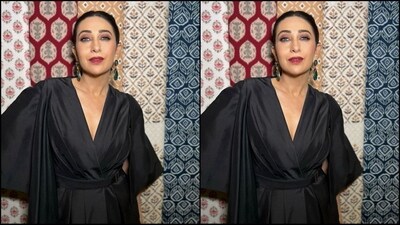 Karishma Kapoor's latest look in a stunning Tarun Tahiliani black ensemble serves a lesson in power dressing. Her outfit features a deep V neckline, flared shoulder-length sleeves, and a belted waist. She perfectly styled it with a pair of emerald drop earrings. With nude eyeshadow, mascara-coated lashes, blushed cheeks, bold red lips, and her tresses tied in a neat bun, she finished off her chic look. (Instagram/@therealkarismakapoor) Karishma Kapoor's latest look in a stunning Tarun Tahiliani black ensemble serves a lesson in power dressing. Her outfit features a deep V neckline, flared shoulder-length sleeves, and a belted waist. She perfectly styled it with a pair of emerald drop earrings. With nude eyeshadow, mascara-coated lashes, blushed cheeks, bold red lips, and her tresses tied in a neat bun, she finished off her chic look. (Instagram/@therealkarismakapoor)