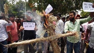Students burn an effigy during their protest against the NEET UG entrance exam paper leak, in Patna. (ANI) Students burn an effigy during their protest against the NEET UG entrance exam paper leak, in Patna. (ANI)