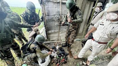 Assam Rifles and Manipur Police personnel recover arms, ammunition, explosives and other items at Charoibung in Imphal West district of Manipur on June 19. (PTI) Assam Rifles and Manipur Police personnel recover arms, ammunition, explosives and other items at Charoibung in Imphal West district of Manipur on June 19. (PTI)