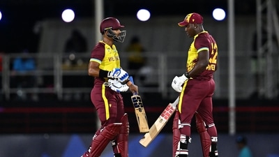 West Indies' captain Rovman Powell (R) and West Indies' wicketkeeper Nicholas Pooran (L) meet after Powell hit a six during the ICC men's Twenty20 World Cup 2024 Super Eight cricket match between England and the West Indies (AFP) West Indies' captain Rovman Powell (R) and West Indies' wicketkeeper Nicholas Pooran (L) meet after Powell hit a six during the ICC men's Twenty20 World Cup 2024 Super Eight cricket match between England and the West Indies (AFP)