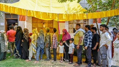 New Delhi, India - May 25, 2024: Voters seen waiting their turn under a makeshift canopy on a hot day at a polling station during the Sixth phase of voting for General Lok Sabha elections , at MC School 64 khamba near Maharaja Ranjeet Singh marg in New Delhi, India, on Saturday, May 25, 2024. (Photo by Raj K Raj/ Hindustan Times) (Hindustan Times) New Delhi, India - May 25, 2024: Voters seen waiting their turn under a makeshift canopy on a hot day at a polling station during the Sixth phase of voting for General Lok Sabha elections , at MC School 64 khamba near Maharaja Ranjeet Singh marg in New Delhi, India, on Saturday, May 25, 2024. (Photo by Raj K Raj/ Hindustan Times) (Hindustan Times)