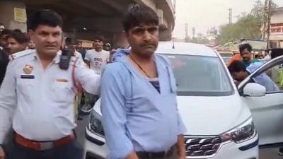 The officer was dragged a few metres after leaning through the driver's door to examine the papers, with the driver suddenly speeding the vehicle 
(PTI Twitter)