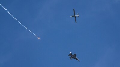 An Israeli fighter jet releases flares, and a drone is seen from Rafah, Gaza Strip, on Tuesday, May 28, 2024. (AP Photo/Abdel Kreem Hana) (AP) An Israeli fighter jet releases flares, and a drone is seen from Rafah, Gaza Strip, on Tuesday, May 28, 2024. (AP Photo/Abdel Kreem Hana) (AP)