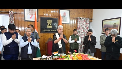 Jammu and Kashmir Lt. Governor Manoj Sinha performs the 'Pratham Puja' to mark the ceremonial commencement of the Annual Amarnath Yatra via video conferencing, in Srinagar. (PTI)