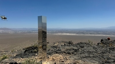 This photo provided by Las Vegas Metropolitan Police Department, the mysterious Monolith is removed on Thursday, June 20, 2024 in Gass Peak, part of the vast Desert National Wildlife Refuge in Nevada. A strange monolith found jutting out of the rocks in a remote mountain range near Las Vegas has been taken down by authorities. (Las Vegas Metropolitan Police Department via AP) (AP) This photo provided by Las Vegas Metropolitan Police Department, the mysterious Monolith is removed on Thursday, June 20, 2024 in Gass Peak, part of the vast Desert National Wildlife Refuge in Nevada. A strange monolith found jutting out of the rocks in a remote mountain range near Las Vegas has been taken down by authorities. (Las Vegas Metropolitan Police Department via AP) (AP)