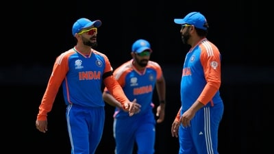 India's Virat Kohli, left, speaks to captain Rohit Sharma, right, during the ICC Men's T20 World Cup cricket match between Afghanistan and India (PTI) India's Virat Kohli, left, speaks to captain Rohit Sharma, right, during the ICC Men's T20 World Cup cricket match between Afghanistan and India (PTI)