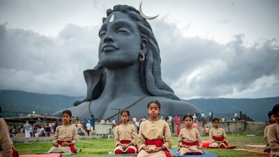 Children participate in a mass yoga session near Adiyogi Shiva statue on the 10th International Day of Yoga, in Bengaluru. (PTI) Children participate in a mass yoga session near Adiyogi Shiva statue on the 10th International Day of Yoga, in Bengaluru. (PTI)