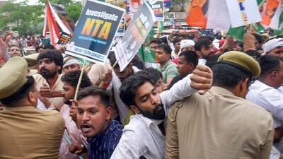 Varanasi: Police personnel try to stop Congress workers during their protest march over the alleged irregularities in NEET-UG 2024 results, in Varanasi, Saturday, June 22, 2024. (PTI Photo)(PTI06_22_2024_000363B) (PTI) Varanasi: Police personnel try to stop Congress workers during their protest march over the alleged irregularities in NEET-UG 2024 results, in Varanasi, Saturday, June 22, 2024. (PTI Photo)(PTI06_22_2024_000363B) (PTI)