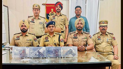 Police officials with the weapons recovered from the accused in Ludhiana on Saturday. (HT Photo) Police officials with the weapons recovered from the accused in Ludhiana on Saturday. (HT Photo)