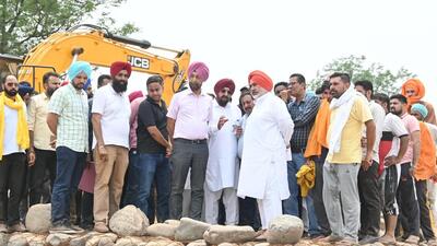 Punjab water resources minister Chetan Singh Jauramajra inspecting the Tiwana bandh at Ghaggar in Mohali. (HT Photo) Punjab water resources minister Chetan Singh Jauramajra inspecting the Tiwana bandh at Ghaggar in Mohali. (HT Photo)
