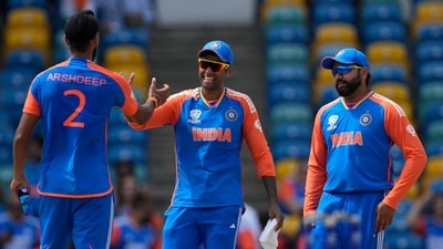 India's Suryakumar Yadav, center, and teammates celebrate after their win in the ICC Men's T20 World Cup cricket match between Afghanistan and India (AP)