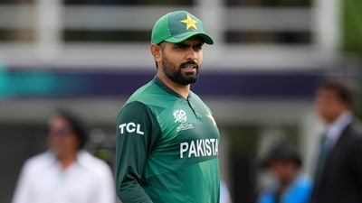Pakistan's captain Babar Azam waits for the coin toss before the beginning of the ICC Men's T20 World Cup cricket match between Ireland and Pakistan (AP) Pakistan's captain Babar Azam waits for the coin toss before the beginning of the ICC Men's T20 World Cup cricket match between Ireland and Pakistan (AP)