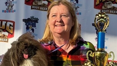 Wild Thang, the winner of 2024 'World’s Ugliest Dog' contest, with its owner. (Sumiko Moots / NBC News)