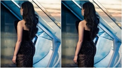 To complement her stunning black backless dress, she styled her long, luscious tresses into soft curls and left them open in a side part, allowing them to perfectly cascade down her shoulders. This added a touch of retro chic to her head-turning look. (Instagram/@ambani_update) To complement her stunning black backless dress, she styled her long, luscious tresses into soft curls and left them open in a side part, allowing them to perfectly cascade down her shoulders. This added a touch of retro chic to her head-turning look. (Instagram/@ambani_update)