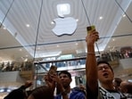 Customers cheer as they enter Apple Inc.'s store during its opening in Kuala Lumpur, Malaysia, on Saturday, June 22, 2024. Customers cheer as they enter Apple Inc.'s store during its opening in Kuala Lumpur, Malaysia, on Saturday, June 22, 2024.