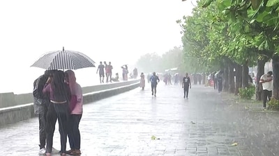 People at Marine drive enjoying the rains, Mumbai has been experiencing the onset of southwest monsoon and gusty winds as well (ANI Photo) (ANI) People at Marine drive enjoying the rains, Mumbai has been experiencing the onset of southwest monsoon and gusty winds as well (ANI Photo) (ANI)