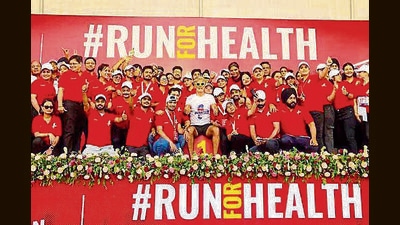 Actor Milind Soman with others after the race in Ludhiana. (HT Photo)