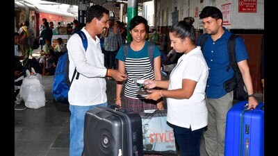 An employee checks tickets at the Ludhiana railway station on Sunday. (Manish/HT)