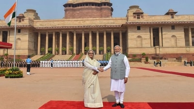 This handout photograph taken and released on June 22, 2024 by the Indian Press Information Bureau (PIB) shows India's Prime Minister Narendra Modi shaking hands with Bangladesh's counterpart Sheikh Hasina (L) after receiving her at the Presidential Palace Rashtrapati Bhavan in New Delhi on June 22, 2024. (Photo by PIB / AFP) (AFP) This handout photograph taken and released on June 22, 2024 by the Indian Press Information Bureau (PIB) shows India's Prime Minister Narendra Modi shaking hands with Bangladesh's counterpart Sheikh Hasina (L) after receiving her at the Presidential Palace Rashtrapati Bhavan in New Delhi on June 22, 2024. (Photo by PIB / AFP) (AFP)