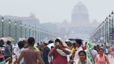 People walk along the Kartavya Path among humid conditions on Sunday. (Arvind Yadav/HT Photo) People walk along the Kartavya Path among humid conditions on Sunday. (Arvind Yadav/HT Photo)
