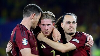 Belgium's Kevin De Bruyne reacts with Jan Vertonghen and Arthur Theate after the match (REUTERS)