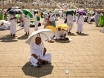 Muslim pilgrims use umbrellas to shade themselves from the sun as they arrive at the base of Mount Arafat, also known as Jabal al-Rahma or Mount of Mercy, during the annual hajj pilgrimage on June 15, 2024. Muslim pilgrims use umbrellas to shade themselves from the sun as they arrive at the base of Mount Arafat, also known as Jabal al-Rahma or Mount of Mercy, during the annual hajj pilgrimage on June 15, 2024.