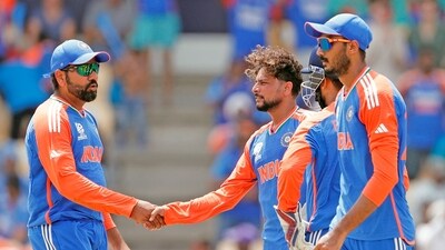 India's Rohit Sharma (c) and Kuldeep Yadav celebrate the dismissal of Australia's Glenn Maxwell (ANI) India's Rohit Sharma (c) and Kuldeep Yadav celebrate the dismissal of Australia's Glenn Maxwell (ANI)