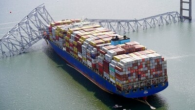 In this aerial image released by the Maryland National Guard, the cargo ship Dali is stuck under part of the structure of the Francis Scott Key Bridge after the ship hit the bridge, Tuesday, March 26, 2024, in Baltimore. (AP)