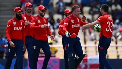 England's Mark Wood (R) celebrates with England's captain Jos Buttler and teammates after running out South Africa's Heinrich Klaasen during the ICC men's Twenty20 World Cup (AFP) England's Mark Wood (R) celebrates with England's captain Jos Buttler and teammates after running out South Africa's Heinrich Klaasen during the ICC men's Twenty20 World Cup (AFP)