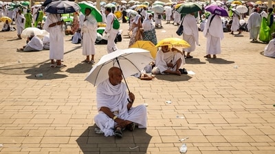 Muslim pilgrims use umbrellas to shade themselves from the sun as they arrive at the base of Mount Arafat, also known as Jabal al-Rahma or Mount of Mercy, during the annual hajj pilgrimage on June 15, 2024. (AFP) Muslim pilgrims use umbrellas to shade themselves from the sun as they arrive at the base of Mount Arafat, also known as Jabal al-Rahma or Mount of Mercy, during the annual hajj pilgrimage on June 15, 2024. (AFP)