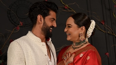 Sonakshi Sinha and Zaheer Iqbal are married! On Sunday, Sonakshi made her first appearance post-wedding at their reception at Bastian in Mumbai in a red saree. Zaheer chose a white ethnic look. (AFP) Sonakshi Sinha and Zaheer Iqbal are married! On Sunday, Sonakshi made her first appearance post-wedding at their reception at Bastian in Mumbai in a red saree. Zaheer chose a white ethnic look. (AFP)