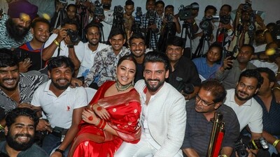 Sonakshi Sinha and Zaheer Iqbal posed for photos with paparazzi at their wedding ceremony, The actors hosted a grand wedding reception, which was graced by a number of Bollywood celebrities. (PTI) Sonakshi Sinha and Zaheer Iqbal posed for photos with paparazzi at their wedding ceremony, The actors hosted a grand wedding reception, which was graced by a number of Bollywood celebrities. (PTI)