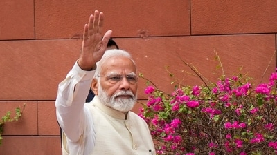 Prime Minister Narendra Modi waves as he arrives at the Parliament House complex on the first day of the first session of the 18th Lok Sabha. (PTI) Prime Minister Narendra Modi waves as he arrives at the Parliament House complex on the first day of the first session of the 18th Lok Sabha. (PTI)