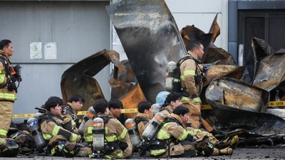Firefighters take a break as rescue work continues following a deadly fire at a lithium battery factory owned by South Korean battery maker Aricell, in Hwaseong, South Korea (REUTERS)