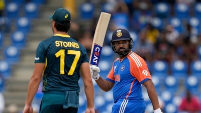 Rohit walked out all guns blazing and unleashed carnage on Australia in the first 10 overs after his side were put to bat first by Mitchell Marsh. He smashed 28 of the 29 runs that were scored in the third over of the match bowled by Mitchell Starc. He continued on his merry way after a brief rain break in the next over and blazed a 19-ball half-century. (AP) Rohit walked out all guns blazing and unleashed carnage on Australia in the first 10 overs after his side were put to bat first by Mitchell Marsh. He smashed 28 of the 29 runs that were scored in the third over of the match bowled by Mitchell Starc. He continued on his merry way after a brief rain break in the next over and blazed a 19-ball half-century. (AP)