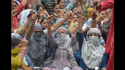 Vocational teachers protesting outside Shiksha Sadan in Sector 5, Panchkula, on Monday. (Sant Arora/HT)