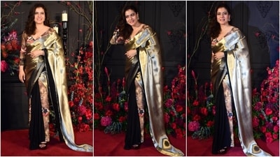 Kajol looked resplendent at Sonakshi and Zaheer's wedding reception party in a silk Shivan and Narresh saree. The triple-hue drape comes adorned with metallic gold, black, and floral print hues. (HT Photo/Varinder Chawla) Kajol looked resplendent at Sonakshi and Zaheer's wedding reception party in a silk Shivan and Narresh saree. The triple-hue drape comes adorned with metallic gold, black, and floral print hues. (HT Photo/Varinder Chawla)