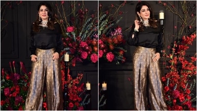 Raveena Tandon turned heads at the bash in a black silk blouse featuring a bateau neckline. She styled the silk top with brocade embroidered flared pleated pants. Lastly, she completed the look with a statement choker necklace, matching jhumkis, rings, and a bracelet. (HT Photo/Varinder Chawla) Raveena Tandon turned heads at the bash in a black silk blouse featuring a bateau neckline. She styled the silk top with brocade embroidered flared pleated pants. Lastly, she completed the look with a statement choker necklace, matching jhumkis, rings, and a bracelet. (HT Photo/Varinder Chawla)