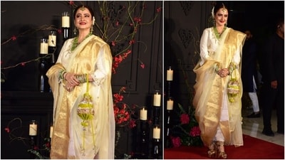 The evergreen Rekha attended Sonakshi's wedding reception dressed in a white and gold silk statement saree draped over an embroidered kurta blouse and churidar pants. She styled the ensemble with gold pumps, green and gold bangles, an emerald bead necklace, a mang tika, rings, jhumkis, bold red lips, kohl-lined eyes, and a potli bag. (HT Photo/Varinder Chawla) The evergreen Rekha attended Sonakshi's wedding reception dressed in a white and gold silk statement saree draped over an embroidered kurta blouse and churidar pants. She styled the ensemble with gold pumps, green and gold bangles, an emerald bead necklace, a mang tika, rings, jhumkis, bold red lips, kohl-lined eyes, and a potli bag. (HT Photo/Varinder Chawla)