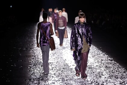 Models present creations by designer Dries Van Noten as part of his Menswear ready-to-wear Spring Summer 2025 collection show during Men's Fashion Week in Paris. (REUTERS/Johanna Geron)