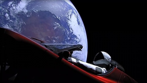 An image from the SpaceX livestream shows "Starman" sitting in SpaceX CEO Elon Musk's cherry red Tesla roadster after the Falcon Heavy rocket delivered it into orbit around the Earth (AFP) An image from the SpaceX livestream shows "Starman" sitting in SpaceX CEO Elon Musk's cherry red Tesla roadster after the Falcon Heavy rocket delivered it into orbit around the Earth (AFP)