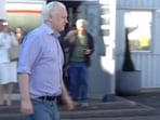 WikiLeaks founder Julian Assange walks to board a plane at a location given as London, Britain, in this still image from video released JUNE 25, 2024.  