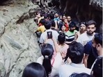 The image shows a crowd in Dehradun’s Gucchupani Cave. The image shows a crowd in Dehradun’s Gucchupani Cave.